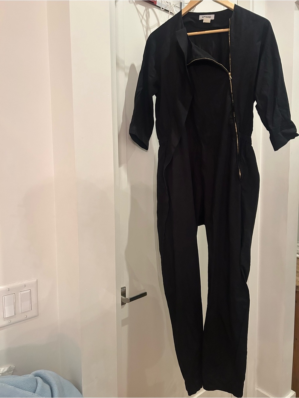 A Detacher To Be Detached Black Tailored Women's Jumpsuit with Angled Gold Zip